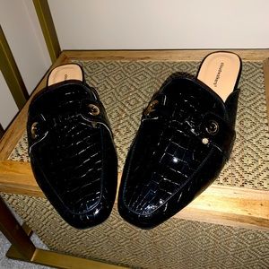 Black patent leather crocodile mules